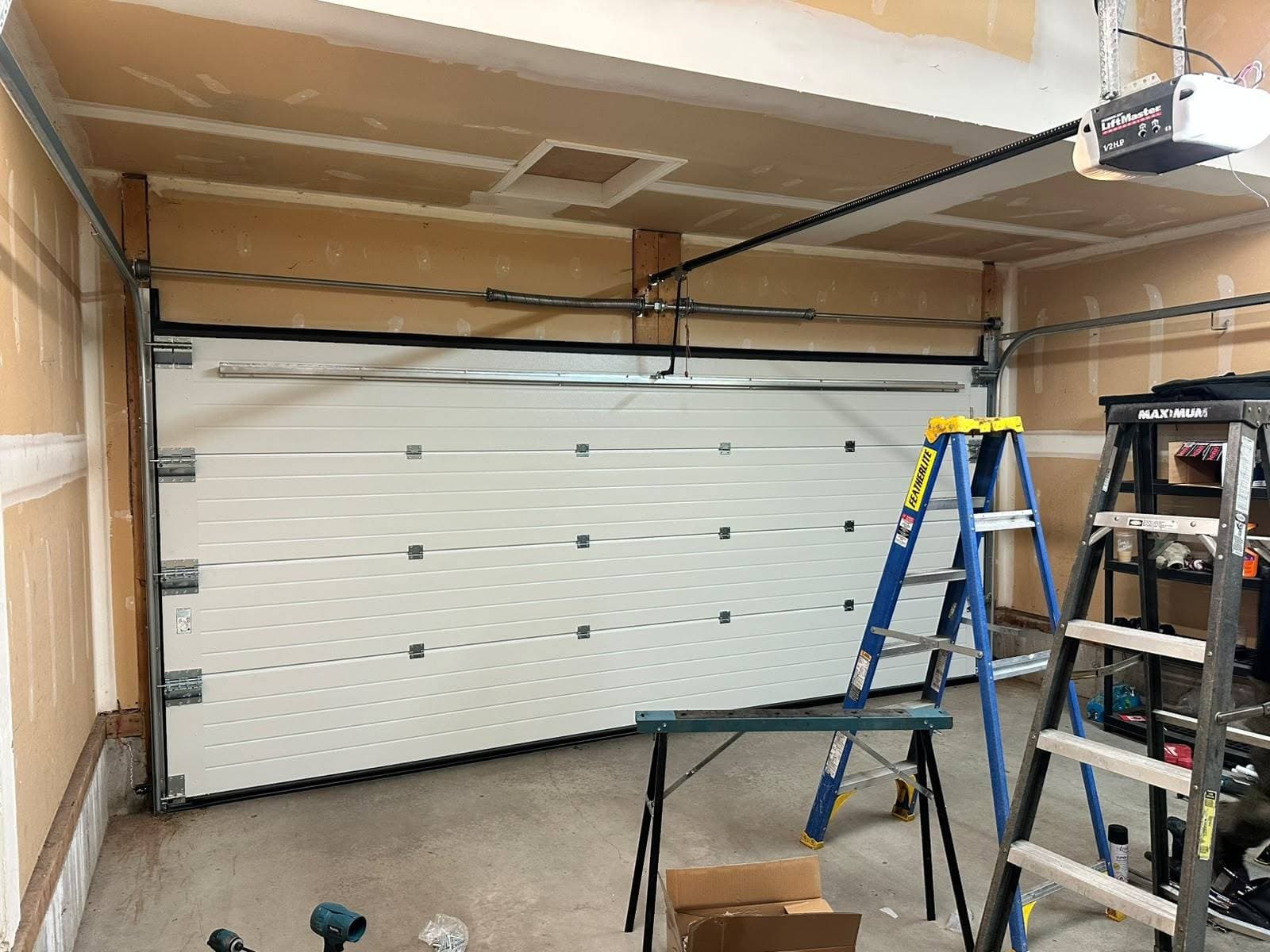 Interior view of the installed Ryterna sectional door, tracks and torsion area